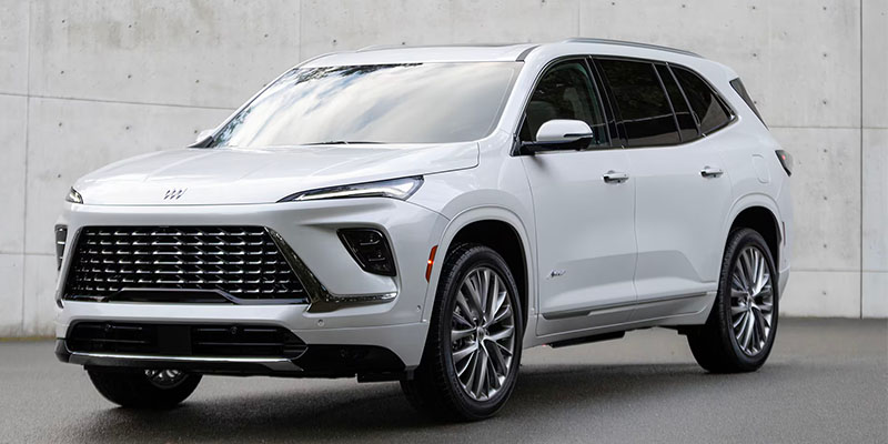Front driver's side view of a white 2025 Buick Enclave